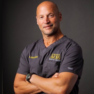 Dr. Alon Antebi in AVORS Medical Group surgical scrubs